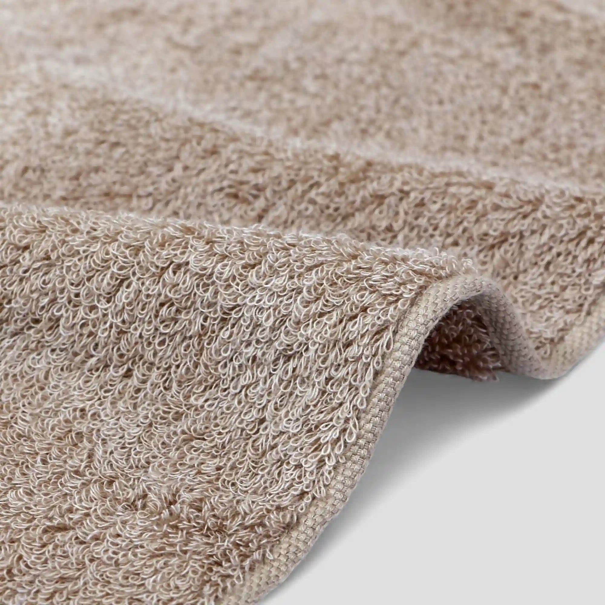 Close-up of a beige Imabari towel corner on a light background