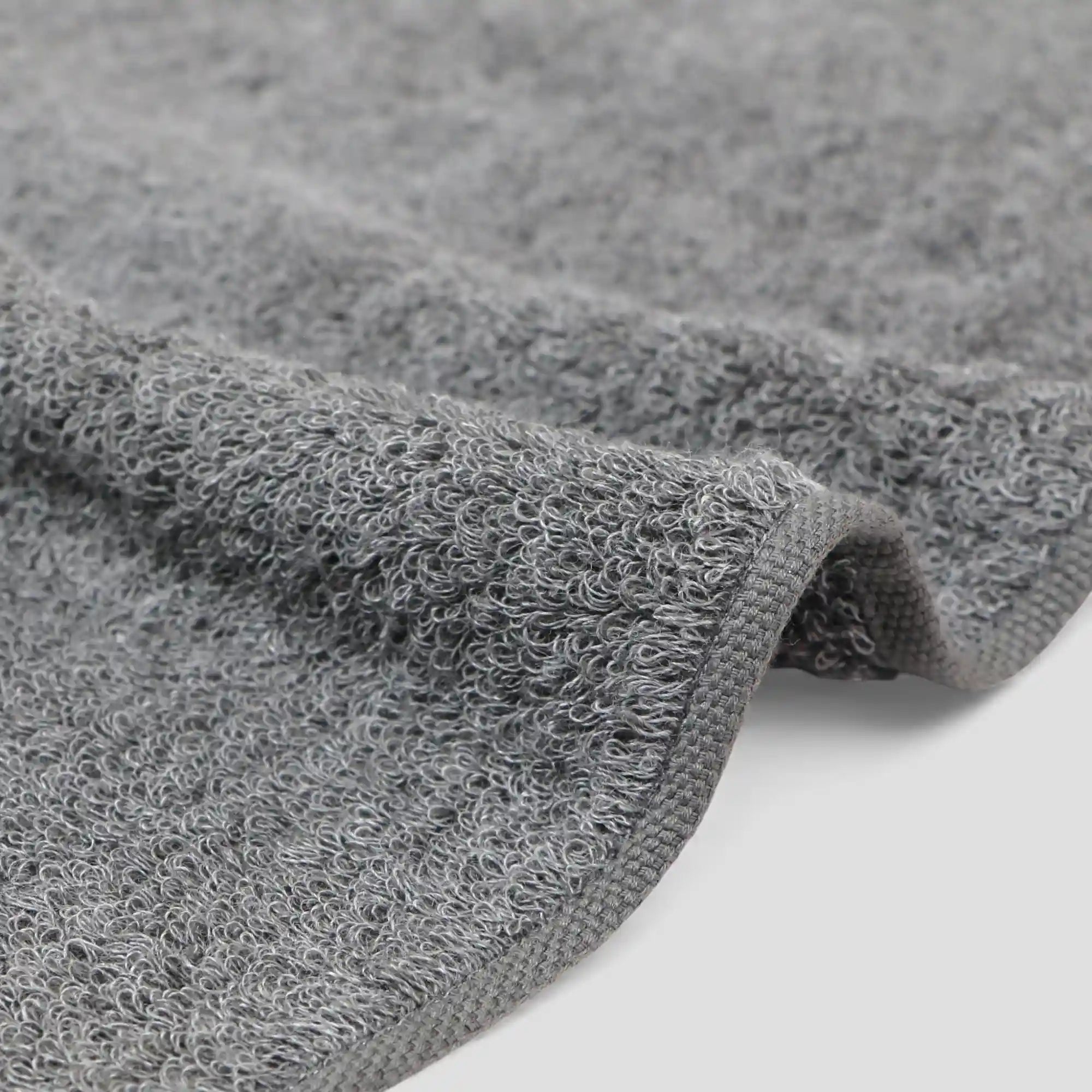 Close-up of a gray Imabari towel fabric on a white background