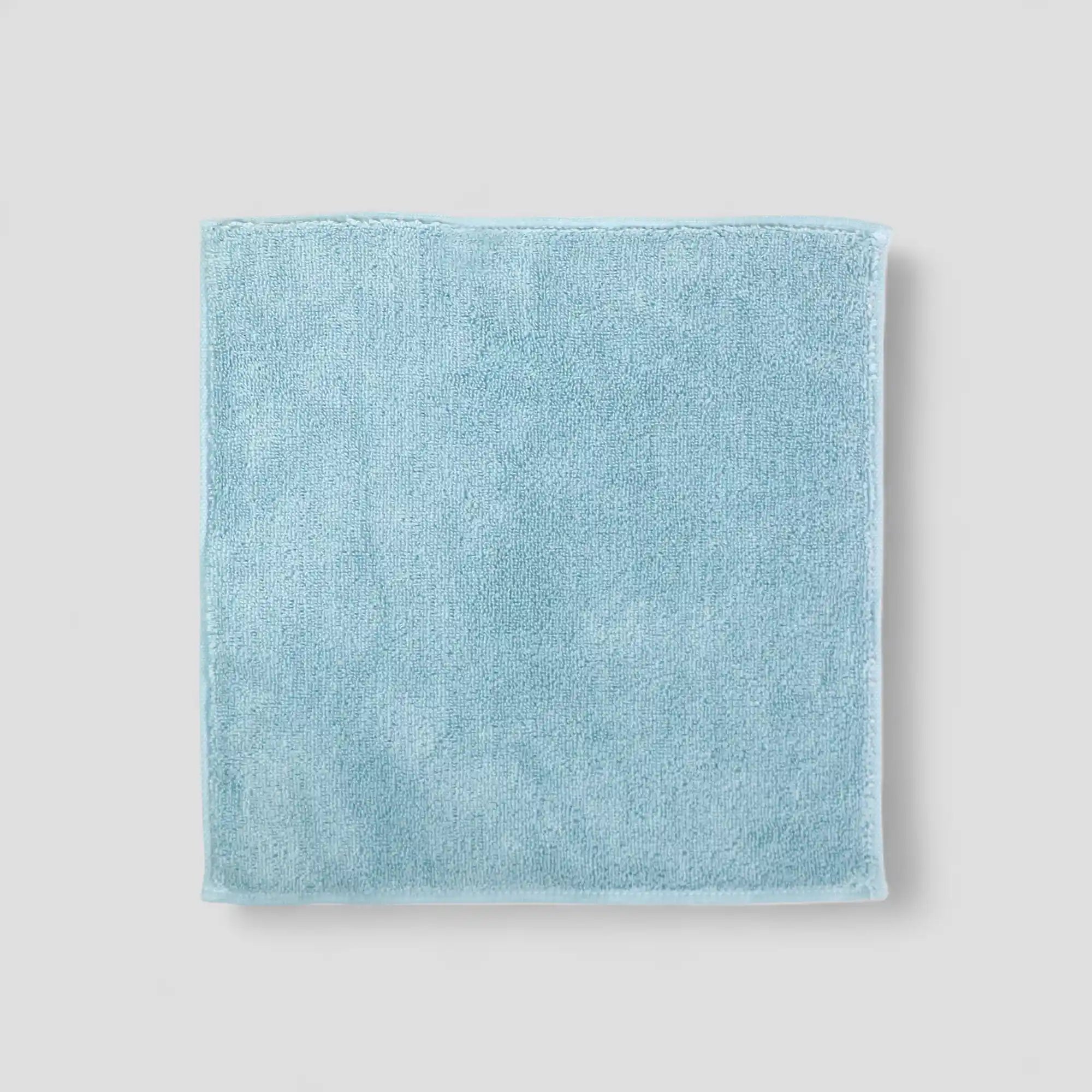 Light blue Imabari towel on a light gray background