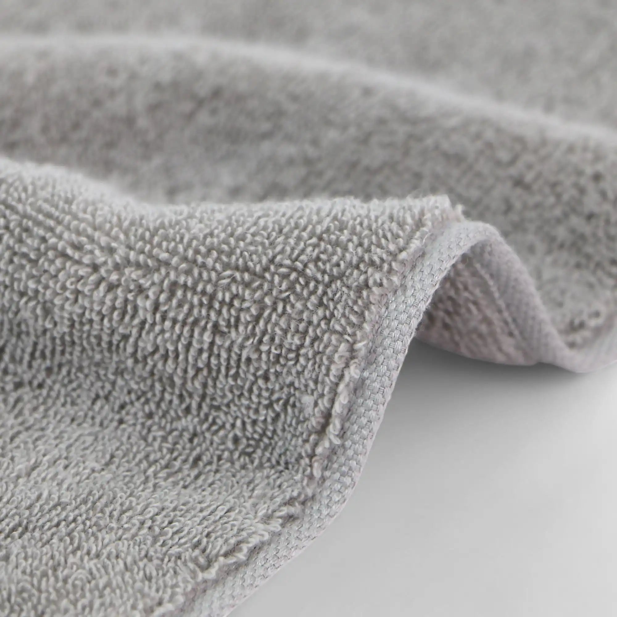 Close-up of a gray textured Imabari towel on a light background