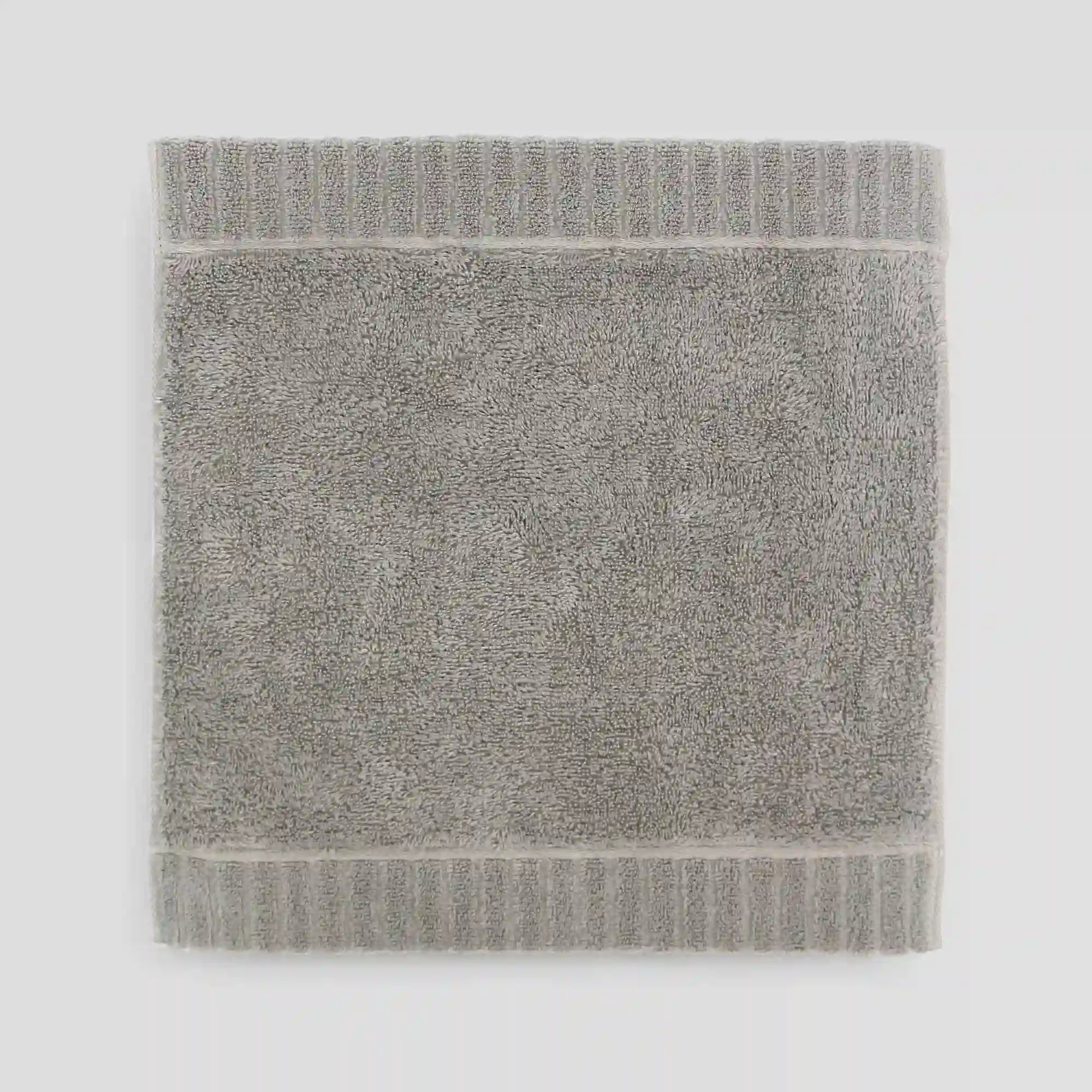 Gray Imabari towel on a light gray background