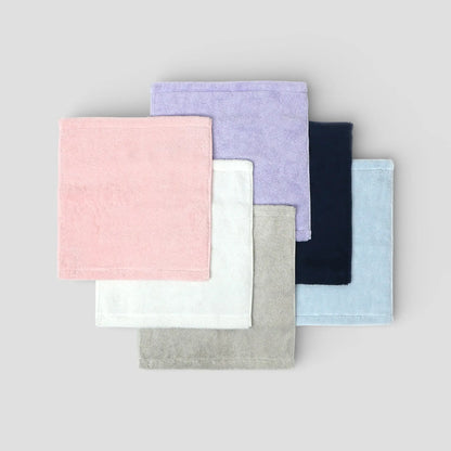 Set of colorful fabric Imabari towels on a gray background