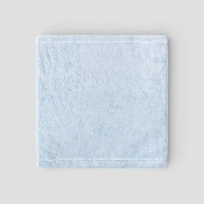 Light blue Imabari towel on a light gray background