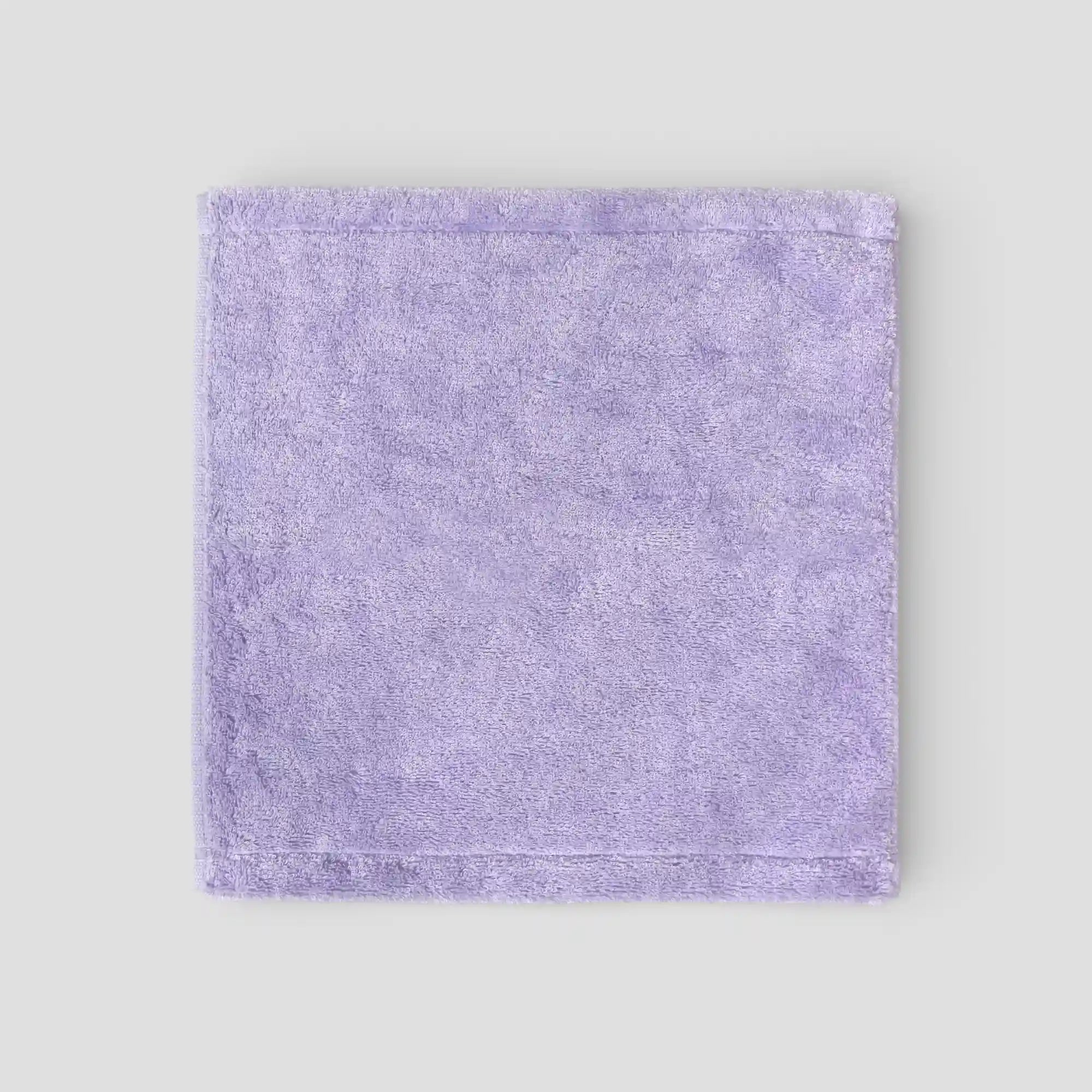 Purple Imabari towel on a light gray background