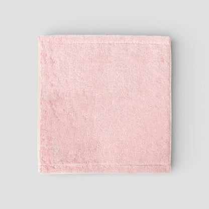 Pink Imabari towel on a gray background