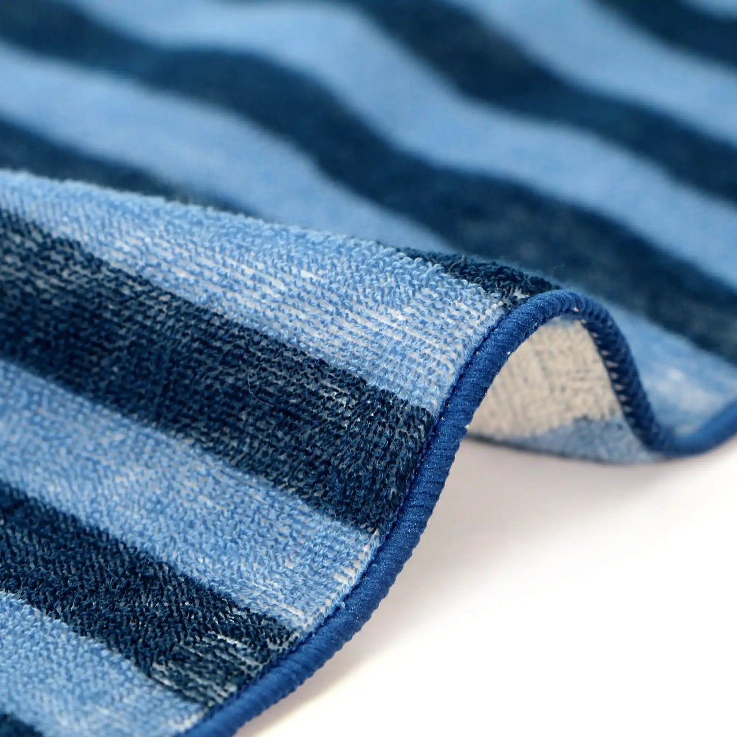 Close-up of blue and navy striped Iambari towel