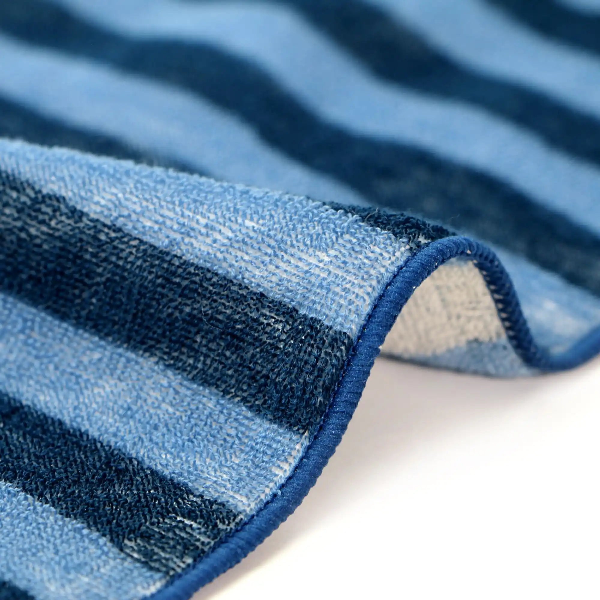 Close-up of blue and navy striped Iambari towel