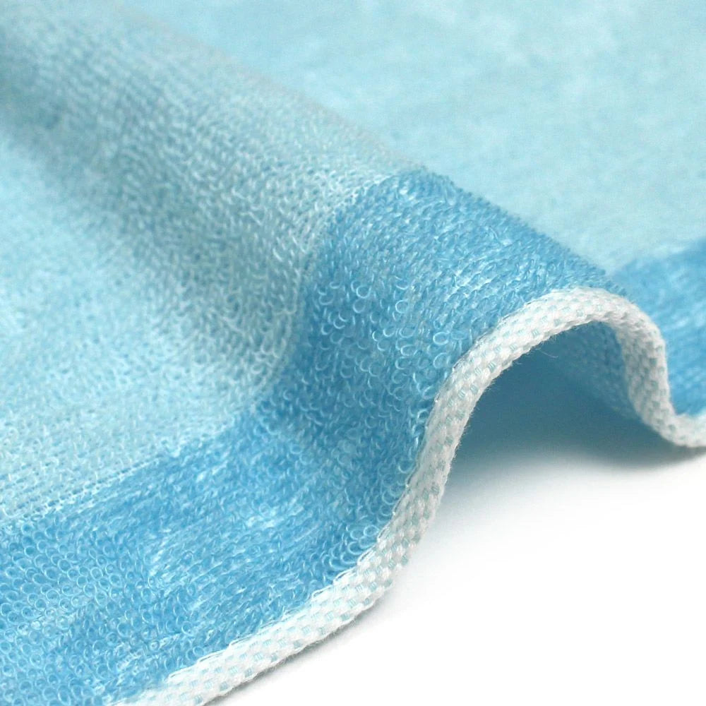 A close-up of the texture and side of a reversible blue mabari towel