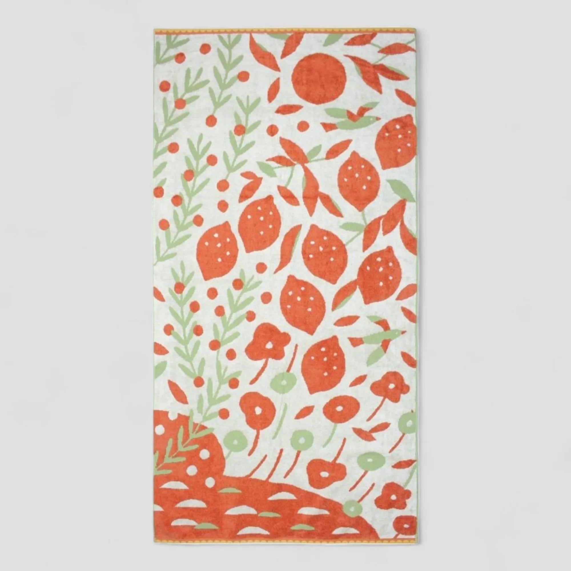 Decorative Imabari towel with orange floral pattern on a light gray background