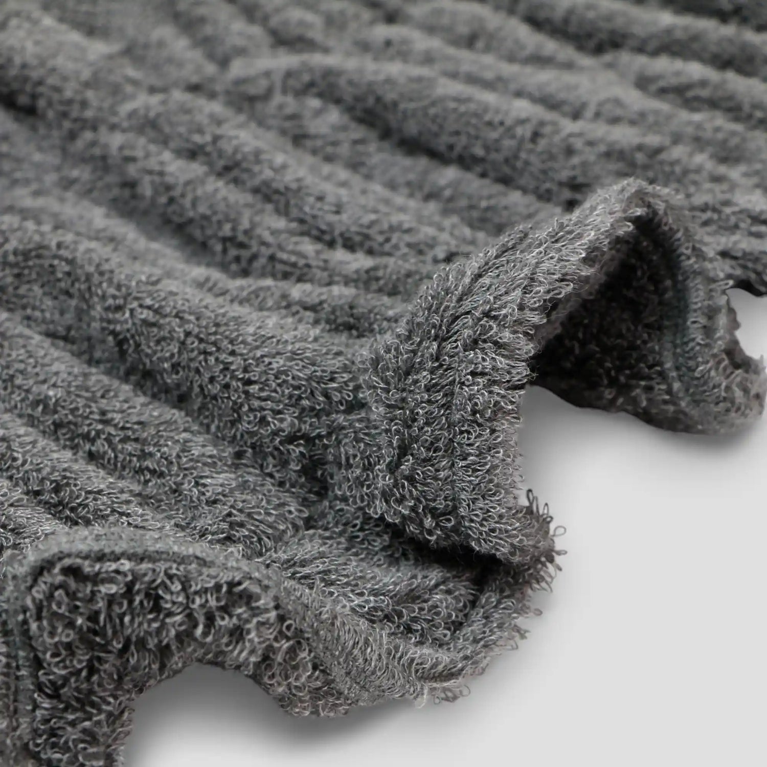 Close-up of gray textured Imabari towel fabric on a light background