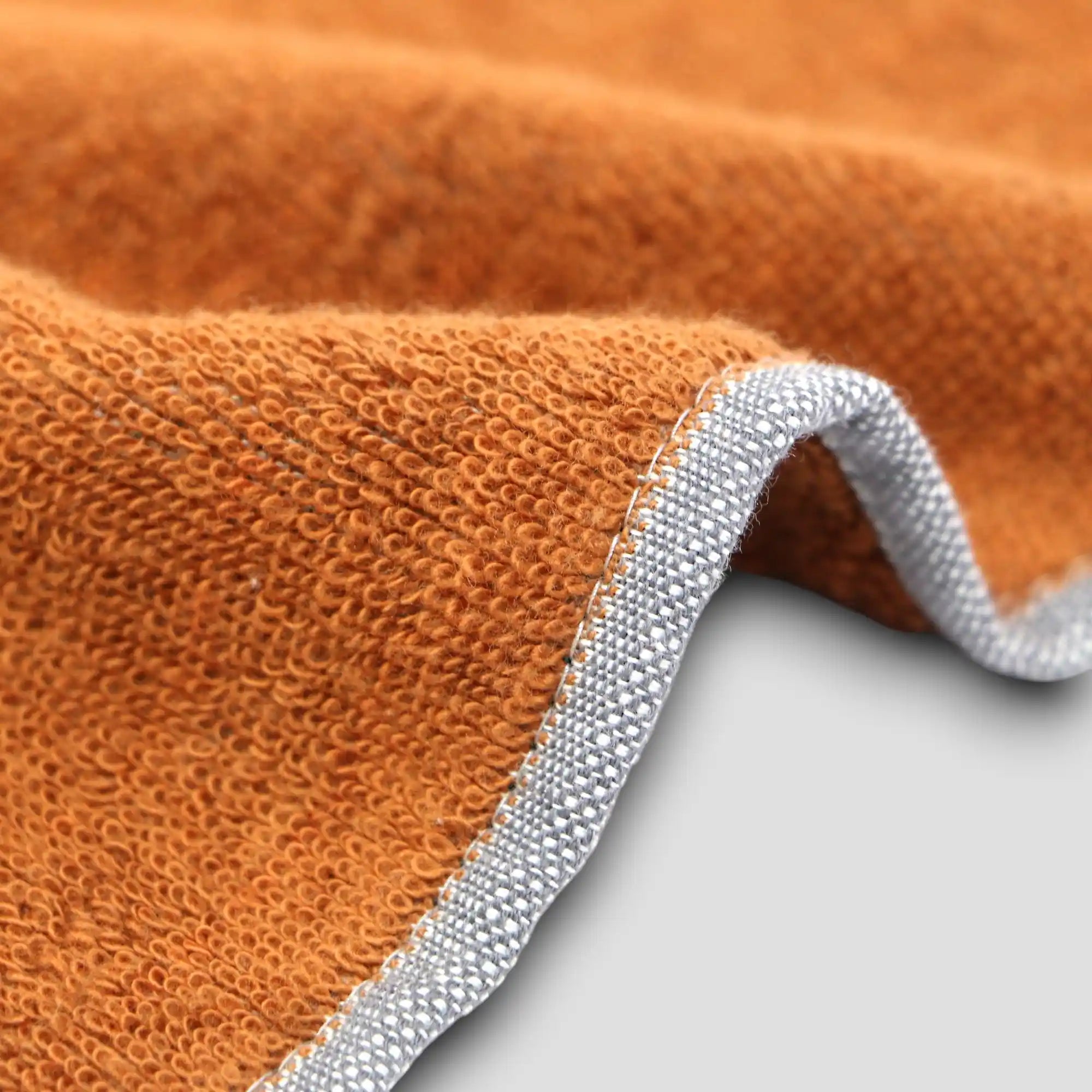 Close-up of a side of  orange Imabari towel 