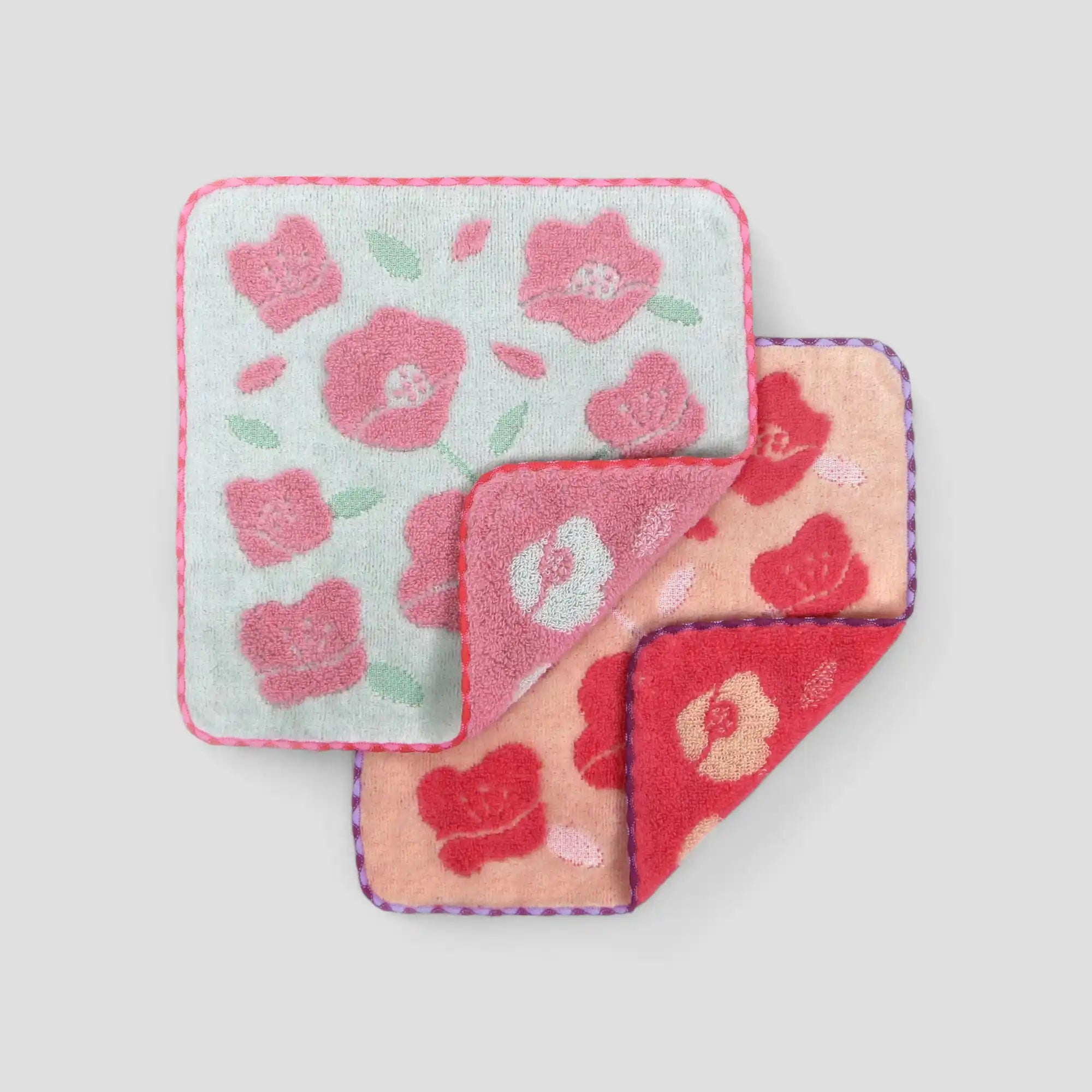 Set of two floral-patterned squared Imabari towel on a light gray background.