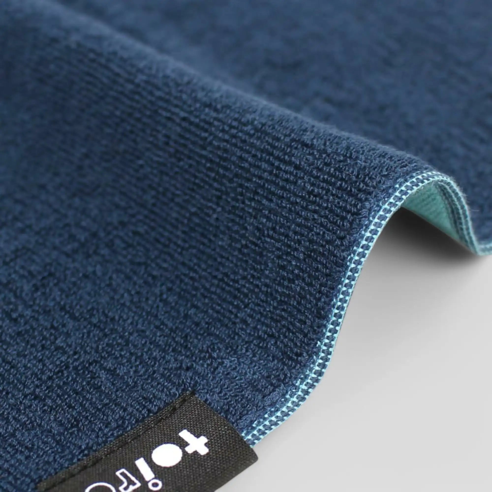 Close-up of a side of navy Imabari towel