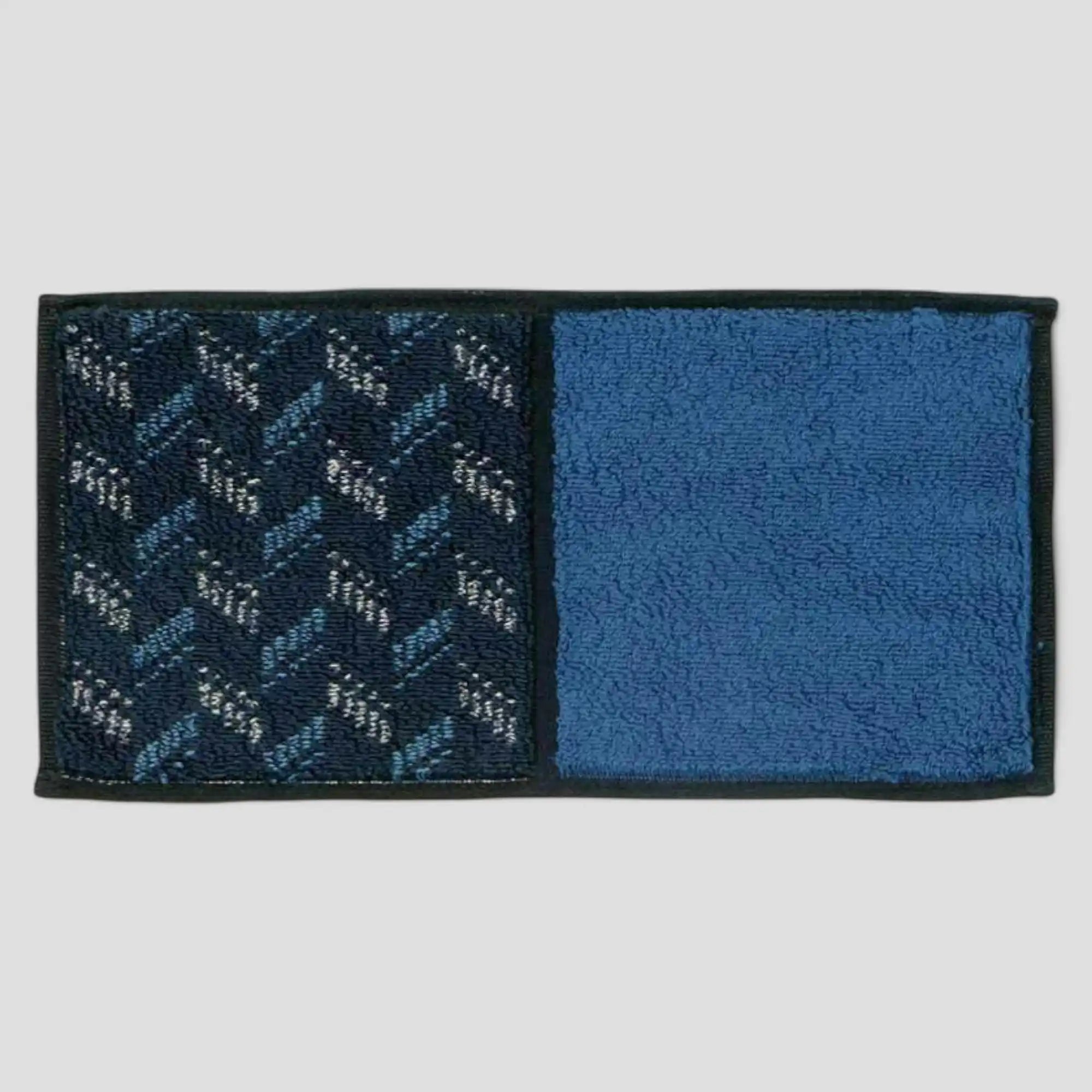 A Imabari towel in blue with navy-blue pattern, displayed against a white background.