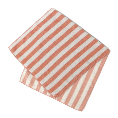 Folded Imabari towel with pink and white stripes on a white background