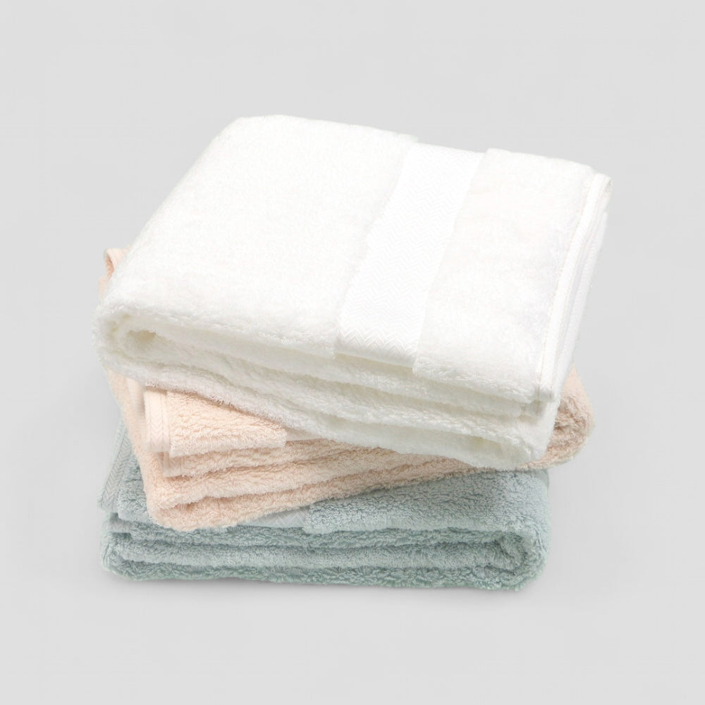 Close-up hero shot of the soft texture of the Iori Lotus premium Imabari bath towel collection.